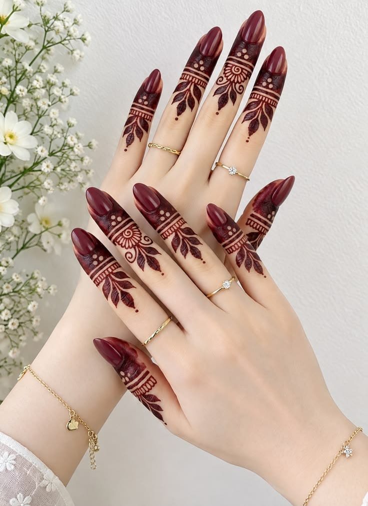 Minimal finger mehndi with delicate floral details, dots, and ring-inspired patterns.