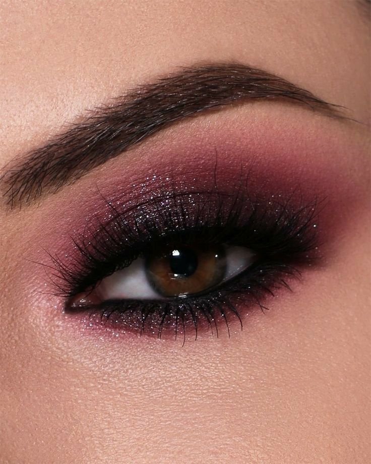  Beginner-friendly Christmas smokey eye makeup with blended charcoal eyeshadow, defined lashes, and nude lipstick.