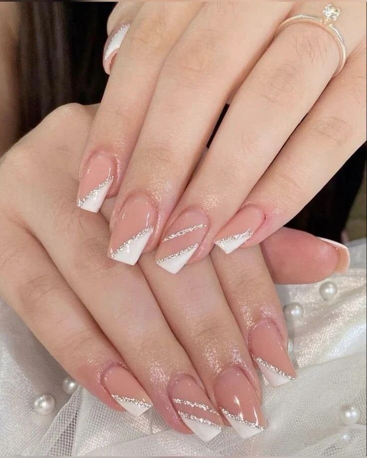 Elegant Christmas French-tip nails with red edges and a natural pink base.