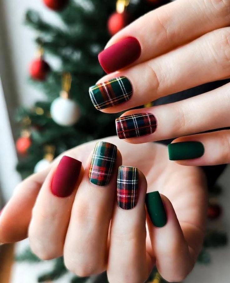 Red and green Christmas plaid nails inspired by traditional winter fabrics.