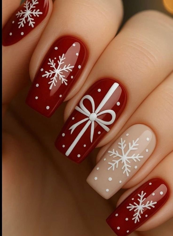  Elegant Christmas bow nail art featuring delicate bows on a neutral base.